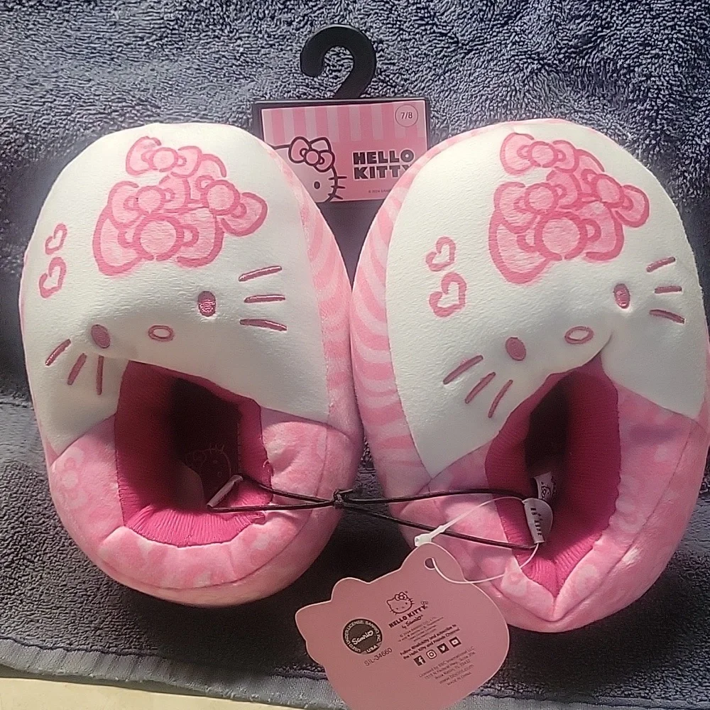 Hello Kitty Pink Plush Slippers and Headband Set. Skippers are size 7/8.